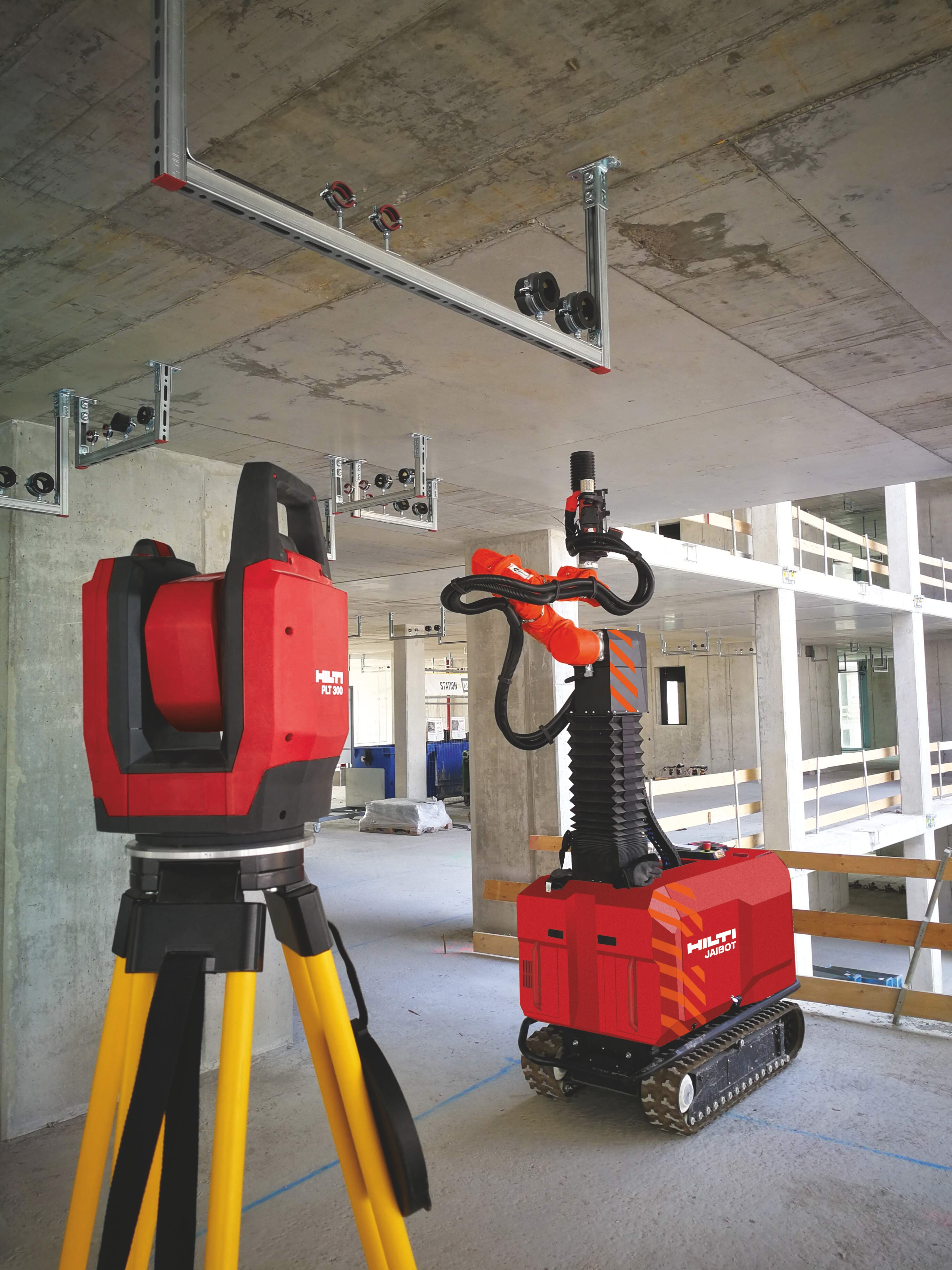 Hilti PLT 300 utsättningsverktyg och Jaibot borrobot utför installationslösningar på en byggarbetsplats.