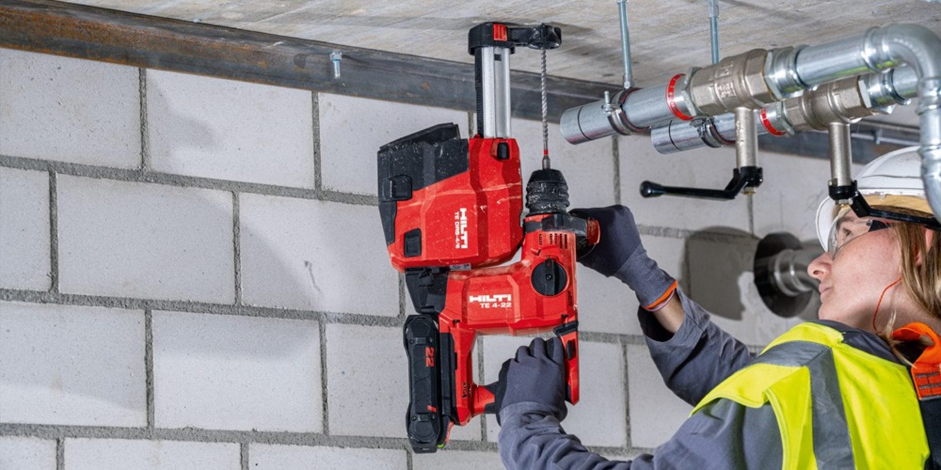 A person is doing overhead work, using the Hilti TE 4-22 cordless rotary hammer
