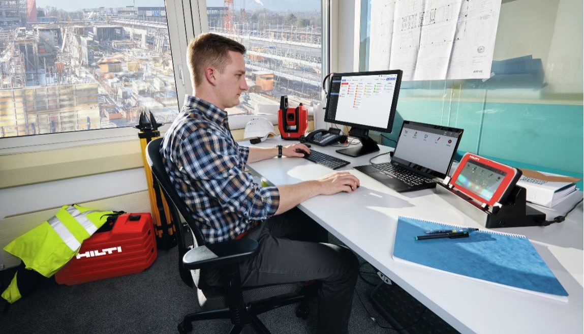 MAN SAT AT DESK