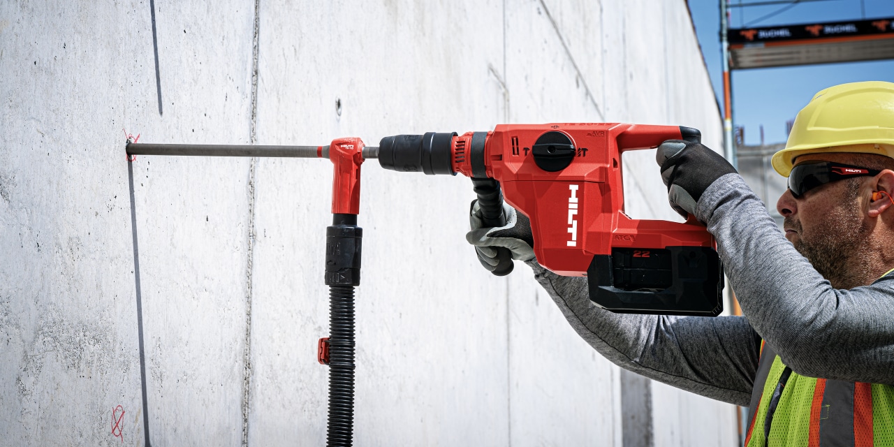 man using Hilti sds rotary hammer drill