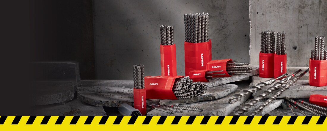red drill bit on a red and yellow back ground